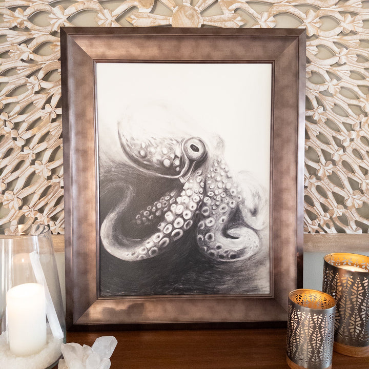 framed charcoal black and white octopus spirit animal art styled on a wood console with candles and crystals for sacred space décor