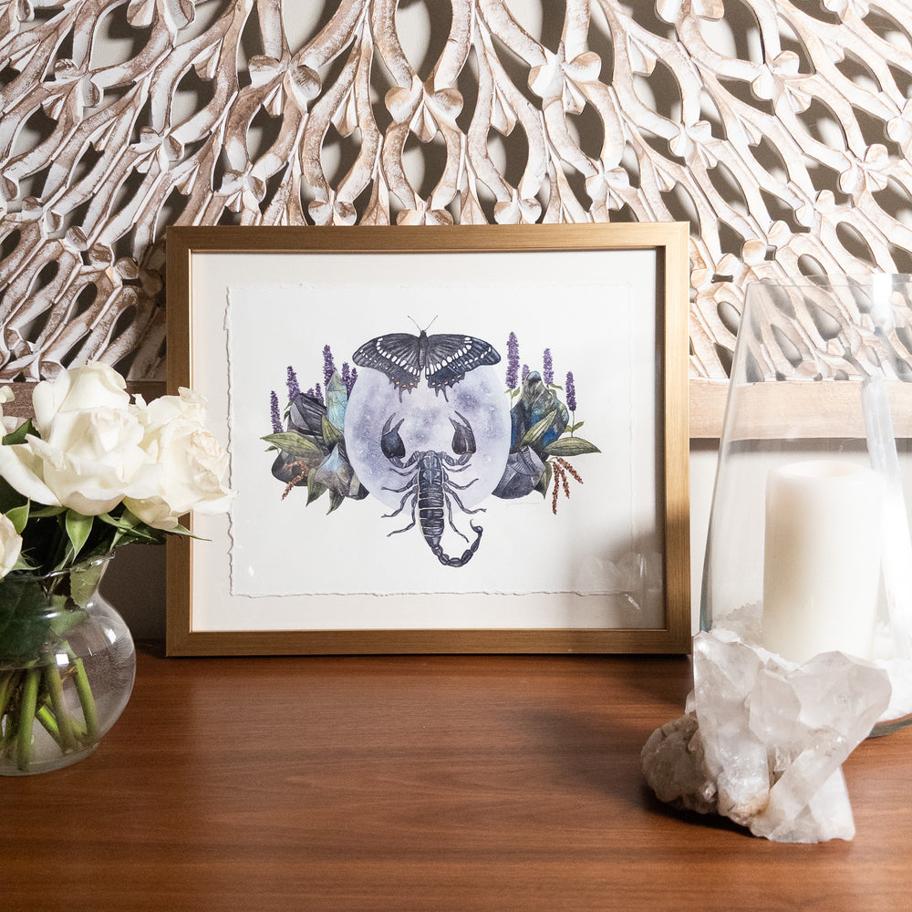 Scorpio full moon framed watercolor painting styled with roses, large crystal and candle for sacred space home décor